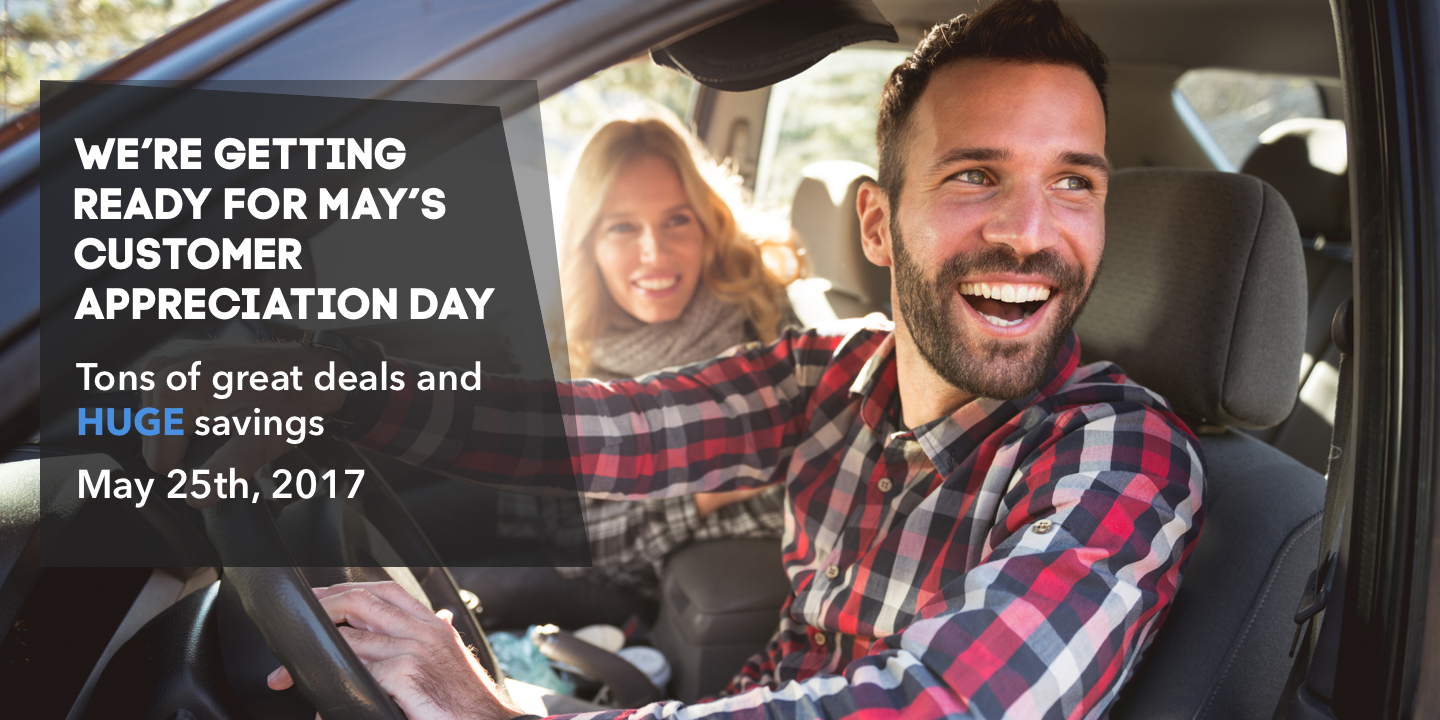 Image of a man and woman sitting in the front seat of a vehicle. Text to the left reads: We're getting ready for May's Customer Appreciation Day. Tons of great deals and Huge savings. 
