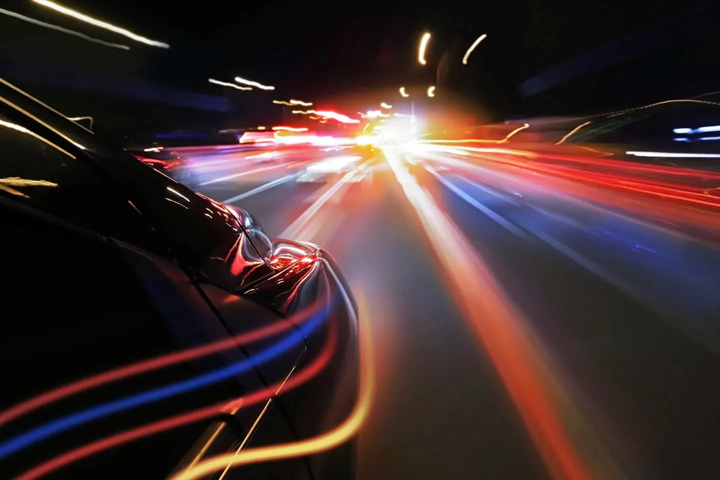 A vehicle in motion with light trails, representing inventory moving across channels